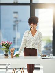 Poster - Success is her game. Shot of a beautiful young businesswoman working in her office.