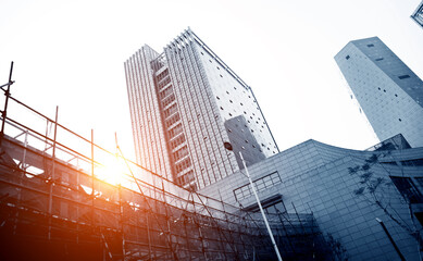 Construction site next to modern office building