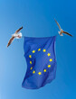 European flag. Two flying seagulls carry the European Union flag.