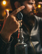 © Volodymyr - Drunk and hangover driver with car key in alcoholism problem and alcohol abuse concept. Man with beard holds glass of brandy.