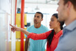 © D Laflor/peopleimages.com - Considering a new strategy. Shot of a group of young designers brainstorming at a whiteboard.