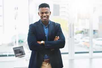 Poster - Success comes naturally to him. Portrait of a young businessman standing in an office.