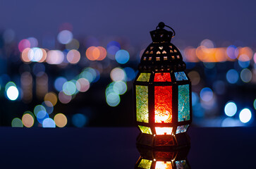 Wall Mural - Lantern with night sky and city bokeh light background for the Muslim feast of the holy month of Ramadan Kareem.