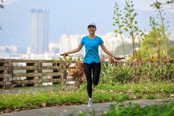 Poster - Asian woman skipping rope in park