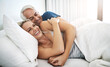 © Camerene Pendl/peopleimages.com - Leisurely days with my love are the best. Shot of an affectionate mature couple lying in bed together at home.