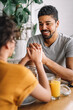 © NDABCREATIVITY - Happy african american couple having breakfast together in the kitchen