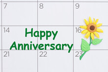 Happy Anniversary Reminder Message On A Calendar With A Sunflower