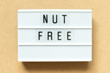 Canvas Print - Lightbox with word nut free on wood background