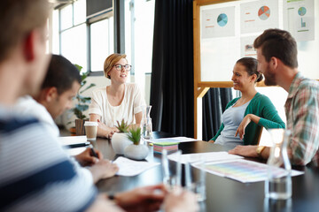 Poster - They each have their own ideas. Cropped shot of young designers working together in their office.