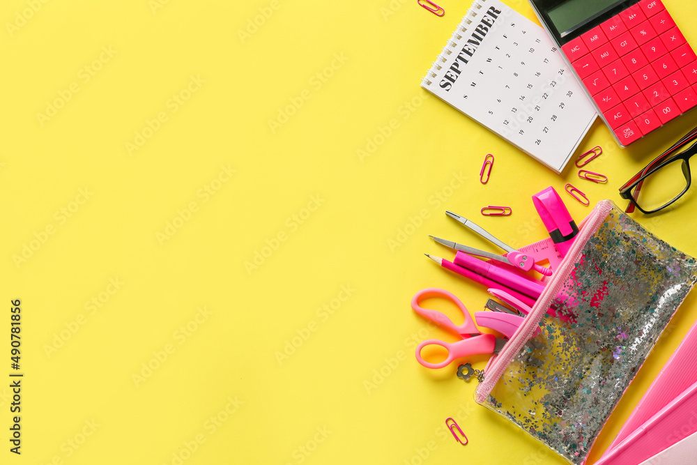 Set of stationery with calendar on yellow background