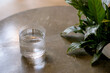water in a transparent glass on a concrete table photo
