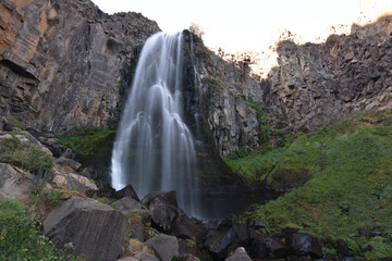 Poster - Beautiful view of the waterfall flowing over the rocks