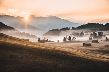 Sticker - Landscape view of the Dolomites mountains under a cloudy sky during the sunrise