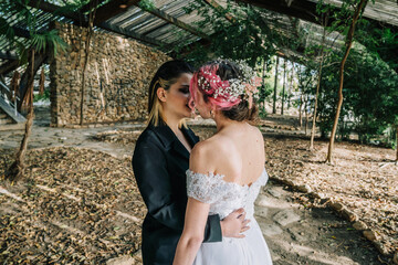 Poster - Closeup of the Caucasian Lesbian couple's sweet gestures on their wedding day