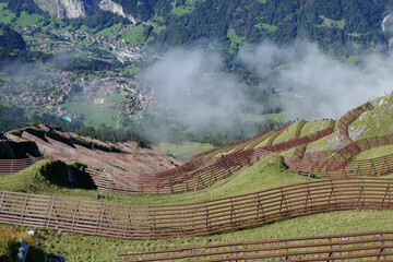 Wall Mural - Bird's eye view of snow fences above the hill