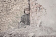 © Jacek - Child and  war. Poor, homeless child in the ruins of a destroyed house.