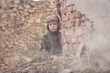 © Jacek - Child and  war. Poor, homeless child in the ruins of a destroyed house.