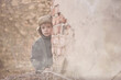 © Jacek - Child and  war. Poor, homeless child in the ruins of a destroyed house.
