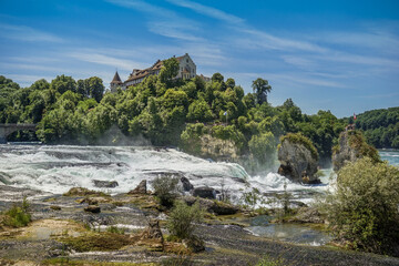 Poster - Whimsical shot of the Laufen Castle on the hill in front of the Rhine Falls in Germany