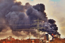 View Of The Construction Site In The Fire With High Power Electricity Poles In The Foreground