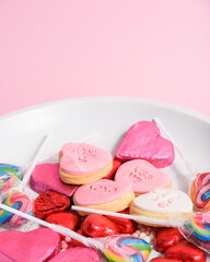 Sticker - Closeup of heart-shaped Valentine's day cookies on a pink background