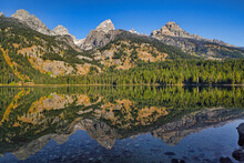 Scenic View Of Bradley Lake Reflecting The Grand Teton Mountains In Wyoming, USA On A Sunny Day