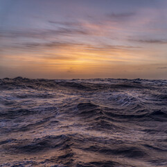 Poster - Vertical shot of the beautiful sunset above the sea.