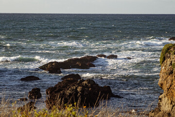 Canvas Print - Beautiful shot of waves breaking on rocky shore