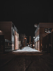 Sticker - Beautiful view of a snowy road in a city at night