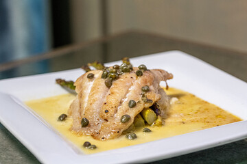 Canvas Print - Closeup of delicious food on a white plate on a table