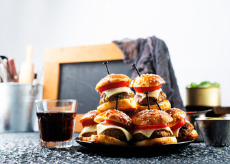 Sticker - homemade beef burgers with cheese on serving board