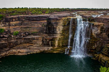 Poster - Aerial view of a waterfall captured at daytime in spring - wallpaper, background