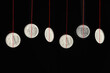 Conceptual image of Indian Rupee coins hanging on strings