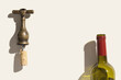Minimal top view vintage corkscrew with uncorked cork and glass bottle for red wine, concept design for wine list on beige background. Bottle-screw or opener with shadows at sunlight, copyspace