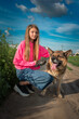 © shymar27 - Portrait of a young beautiful girl in a field with a dog.
