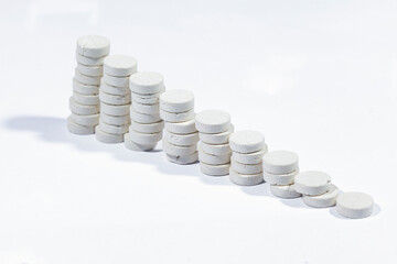 Abstraction of white tablets on a white background.