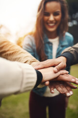 Aufkleber - We know how to be a team too. Shot of a group of cheerful young friends forming a huddle with their hands together outside during the day.