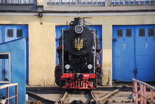 Vintage Black Steam Locomotive. Old Soviet Steam Train In The Depot. Space For Text. Background With A Steam Train.