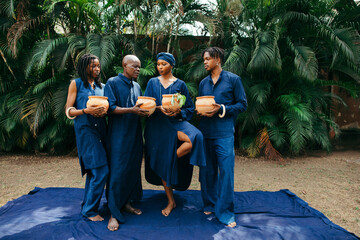 Wall Mural - Wide angle portrait of group of african eco fashion designers standing together