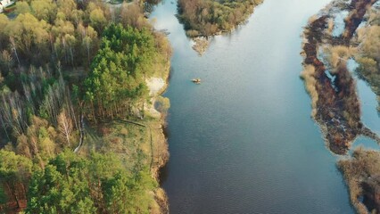 Wall Mural - Aerial View Curved River In Early Spring Landscape. River bends and pine forest landscape. Top View Of Beautiful European Nature From High Attitude. Drone View. Bird's Eye View.