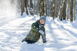 © Katerina.el - little boy throwing snow in the woods in winter