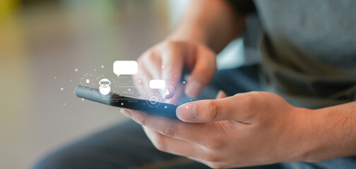 close up man hand use smartphone to contact provider and talk with ai chatbot software program for business marketing concept