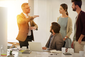 Poster - I think its time we broke some new ground. Cropped shot of a group of businesspeople in the boardroom.