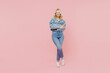 Full body elderly smiling satisfied fun happy woman 50s wearing denim jacket hold hands crossed folded isolated on plain pastel light pink background studio portrait. People lifestyle fashion concept.