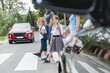 © Photographee.eu - Group of school children goes through the pedestrian crossing in the street, right in front of the car