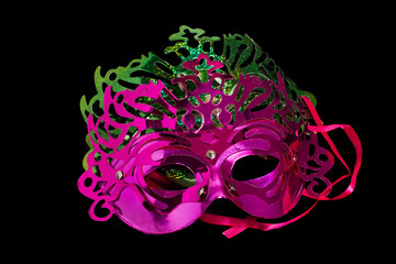 Wall Mural - Multicolored carnival mask on black background.