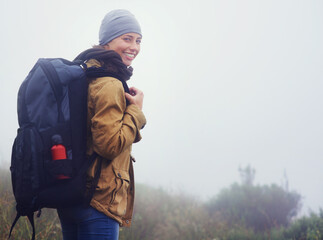 Canvas Print - You should join me.... Portrait of a young woman hiking along a trail on an overcast day.