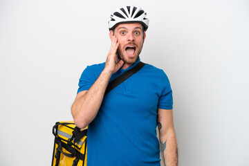 Wall Mural - Young brazilian man with thermal backpack isolated on white background with surprise and shocked facial expression