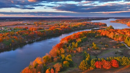 Wall Mural - Rural landscape with incredible Autumn, Fall colors at dusk, moving aerial view.
