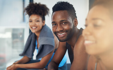 Canvas Print - Surround yourself with fitness minded people. Cropped shot of three young people sitting in the gym after yoga class.